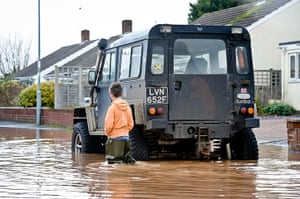 UK flooding: A 4x4 vehicle as it manages to keep above the water level in Ruishton