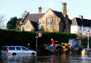 UK flooding: A car is rescued from flood water in Hathern, Leicestershire