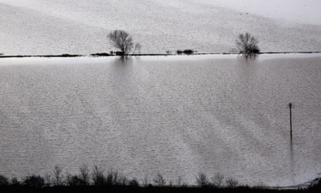 Flooding in Glastonbury in an image that looks more like a painting than a photograph.