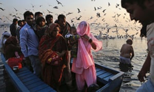 Hindu devotees wait to get off a boat after visiting a temple on a small island in the River Yamuna during Karthik Purnima in New Delhi, India. Karthik Purnima is celebrated on the full moon day of the Hindu calendar month of Karthik and considered very auspicious by Hindus.