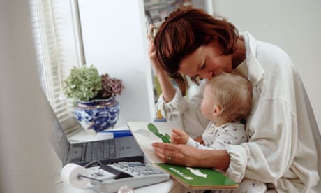 Mother working at home with baby