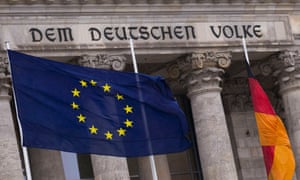 The EU flag and the German national flag fly outside the Reichstag, the seat of Germany's lower house of parliament, the Bundestag, in Berlin