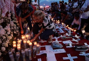 Mexico drug wars gallery: Relatives and friends light candles Monterrey