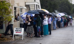 Lines of voters wait in the rain to cast their vote on election day 2012 in St Petersburg, Florida.
