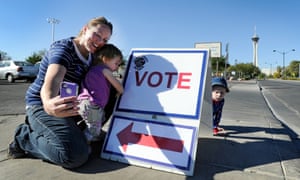 Jaime Lea photographs herself and her children after casting her ballot at John Fremont Middle School on  in Las Vegas, Nevada.