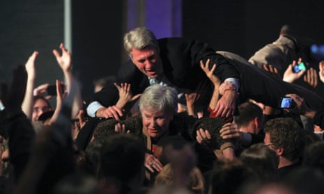 The mayor of Minneapolis, RT Rybak, crowdsurfing with his mother Loraine in celebration of Barack Obama's election victory on 6 November 2012.