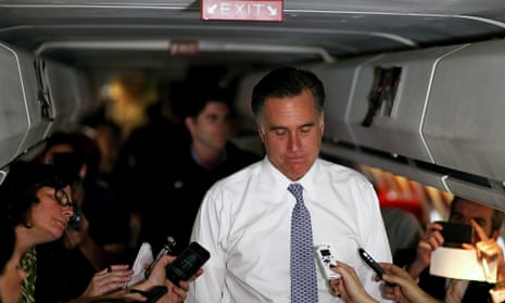 Republican presidential candidate Mitt Romney talks with members of the press aboard his campaign plane.