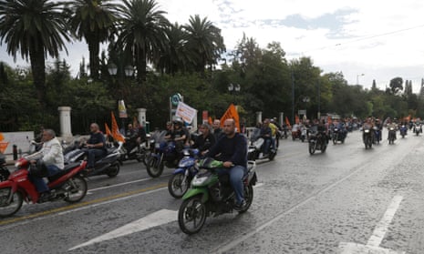 Local authorities workers riding their motorbikes protest,  in central Athens on Wednesday Nov. 7, 2012.