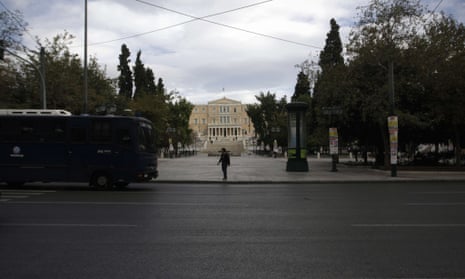 A woman stands on Athens' main Syntagma square on November 7, 2012 during a 48-hour general strike.