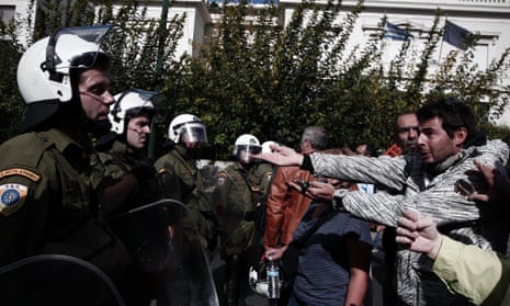 Municipal workers argue with riot police as their colleagues occupy the Administrative Reform ministry in Athens, Greece, 07 November 2012. 