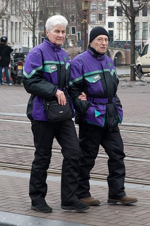 Big Picture: Couples: A couple dressed in matching purple and black waterproof jackets
