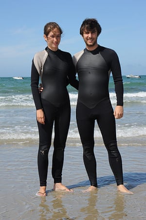 Big Picture: Couples: A couple dressed in matching black wetsuits