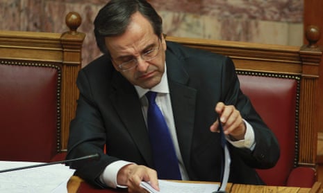 Greece's Prime Minister Antonis Samaras reads his papers during a parliament meeting in Athens, Wednesday, Nov. 7, 2012. 