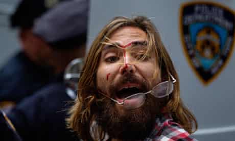 An Occupy Wall Street activist yells at friends after being arrested during demonstrations