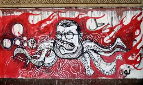 President Mohamed Morsi depicted as an octopus in graffiti on a wall of the presidential palace
