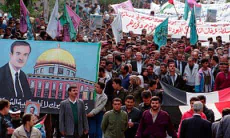 Palestinians in Yarmouk camp, Damascus, demonstrate in 1998 in support of then president Hafez Assad