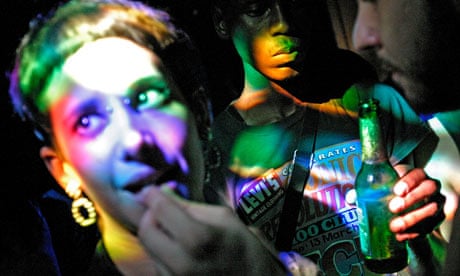 girl takes ecstasy pill in club Shoreditch