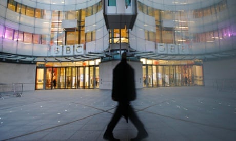 A man walks past the BBC's New Broadcasting House in London. More on the BBC's Pollard enquiry.