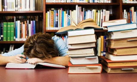 Exhausted Student Falling Asleep While Cramming