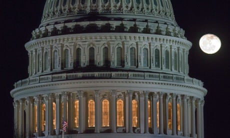 The moon rises behind the U.S. Capitol Dome in Washington as Congress works into the late evening, Sunday, Dec. 30, 2012 to resolve the stalemate over the pending "fiscal cliff."