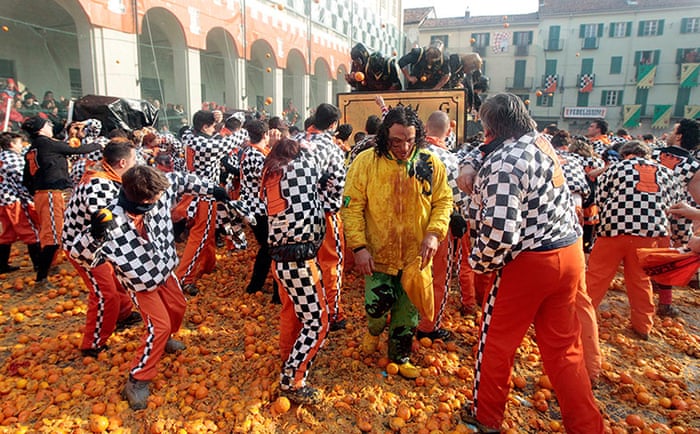 Battle of the Oranges in north Italy – in pictures | World news | The Guardian