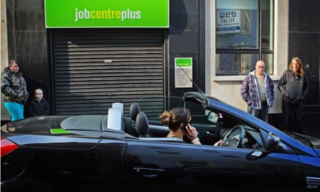 Woman speaks on mobile phone as she drives a sports car