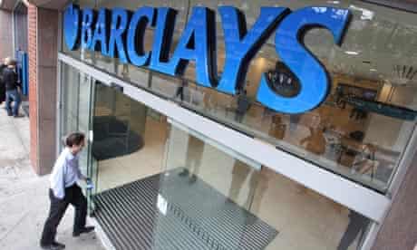 A customer walks into a Barclays bank high street branch