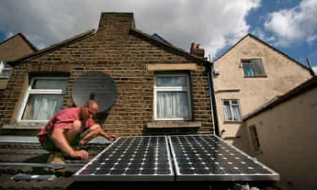 Solar panels being installed on the roof of a house