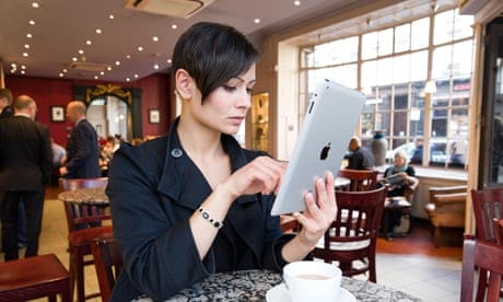 Young woman browsing the Internet on an Apple iPad 2 tablet