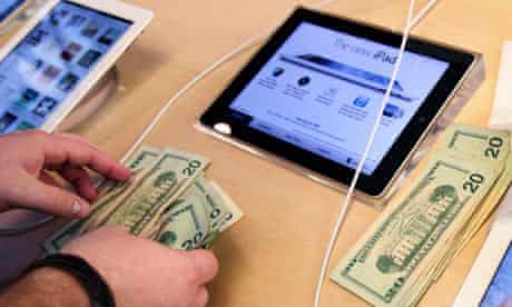 Apple employee counts money new iPad