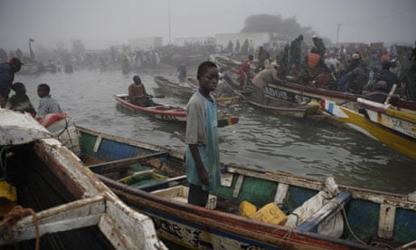 Senegalese fishermen returning from setting nets all night