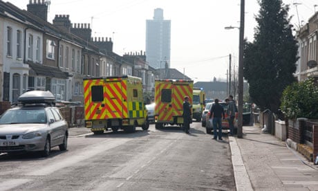 Ambulances in Albert Square, east London, where five police officers were attacked by a dog