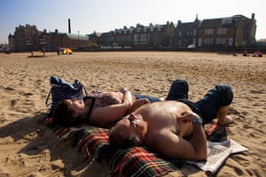 Weather UK: People lie in the sun on Portobello beach