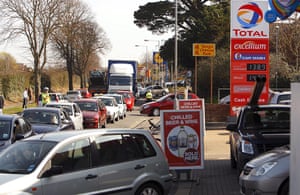 Petrol: Christchurch, Dorset: Police community support officers manage the traffic