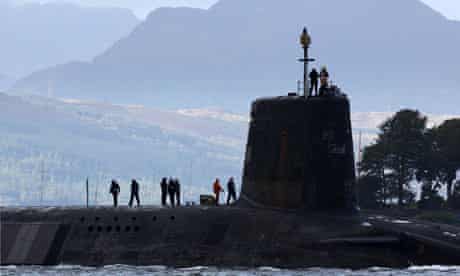 A Vanguard class nuclear submarine, carrying Trident nuclear missiles, leaves Faslane, Scotland.