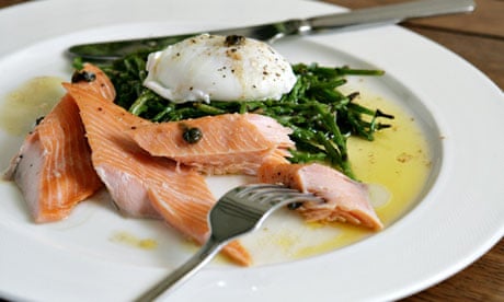 Tea-smoked salmon on sautéed samphire with a poached egg and brown butter