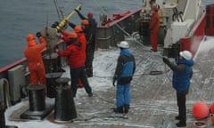 Helen Czerski helps lower the bubble buoy over the stern of the British Antarctic Survey ship