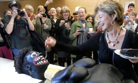 Swedish culture minister Lena Adelsohn Liljeroth feeds cake to blacked-up artist Makode Aj Linde