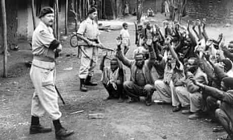British troops round up Kenyan locals for interrogation during Mau May uprising