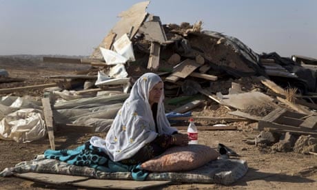 A bedouin woman from al-Turi family sits