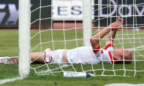Bari defender Andrea Masiello reacts after scoring an own goal during a Serie A match against Lecce