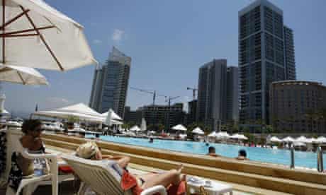 Tourists cool off in a pool in Beirut