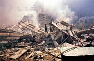 World Trade Centre: 11 September 2001: Firemen walk around Ground Zero