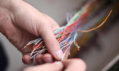 Telecoms: A BT engineer works on cables