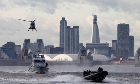 Police and Royal Marines perform a joint exercise ahead of the London 2012 Olympics