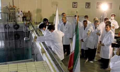 Iranian president, Mahmoud Ahmadinejad, tours a research reactor centre in Tehran