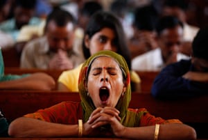 Easter Sunday: An Indian Christian worshipper yawns during prayers on Easter Sunday