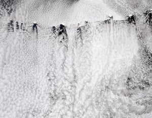Satellite Eye on Earth: Ship-wave-shaped wave clouds and vortices induced by Aleutian Islands