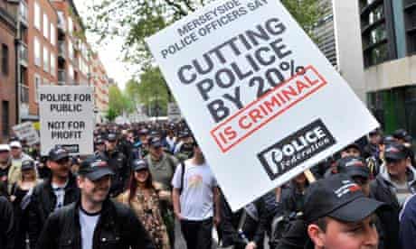 Police officers protest against cuts