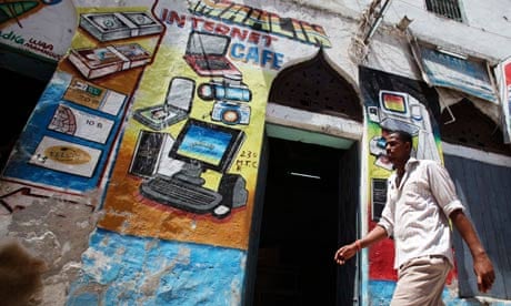 A man walks past an internet cafe in Mogadishu